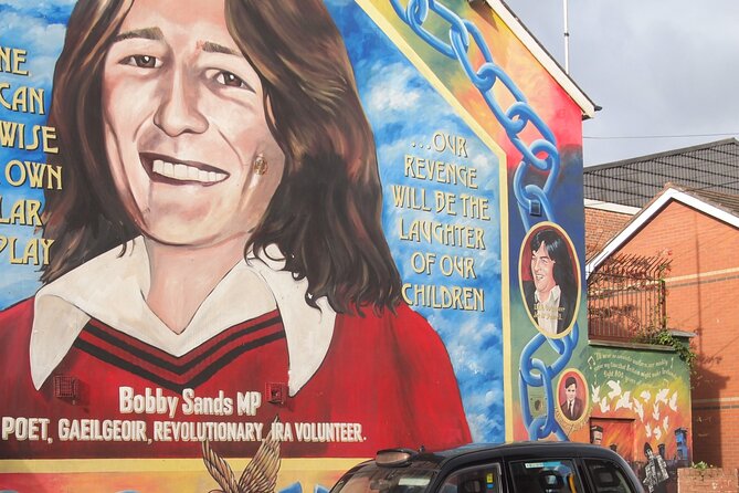 Black Taxi Mural "Tour Like A Local" - The Peace Wall and Belfast’s visible division