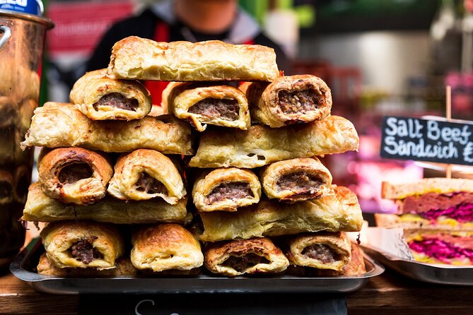 Devour London: Borough Market & Leadenhall Food Tour with Wine - Sausage rolls and modern British sweets at Borough Market