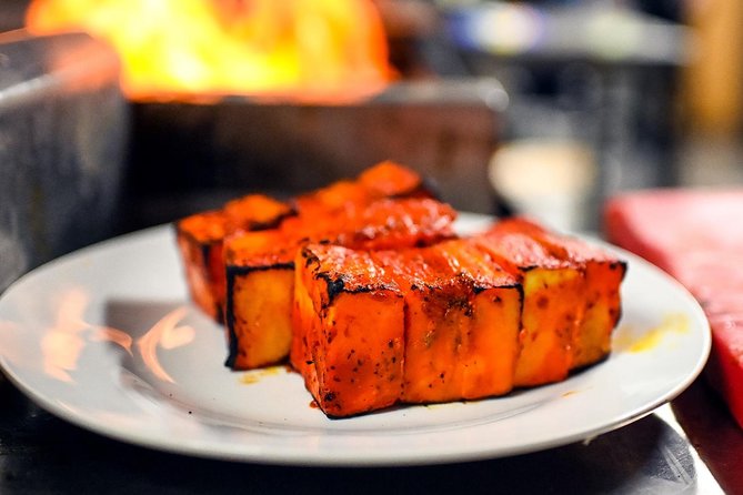 East London Indian Food Tour with 8+ Authentic Food Tastings - The grocery shop adds ingredients to the story