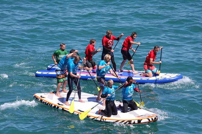 Giant Stand Up Paddle Boarding Experience in Newquay - Along Newquay Bay and into the coves